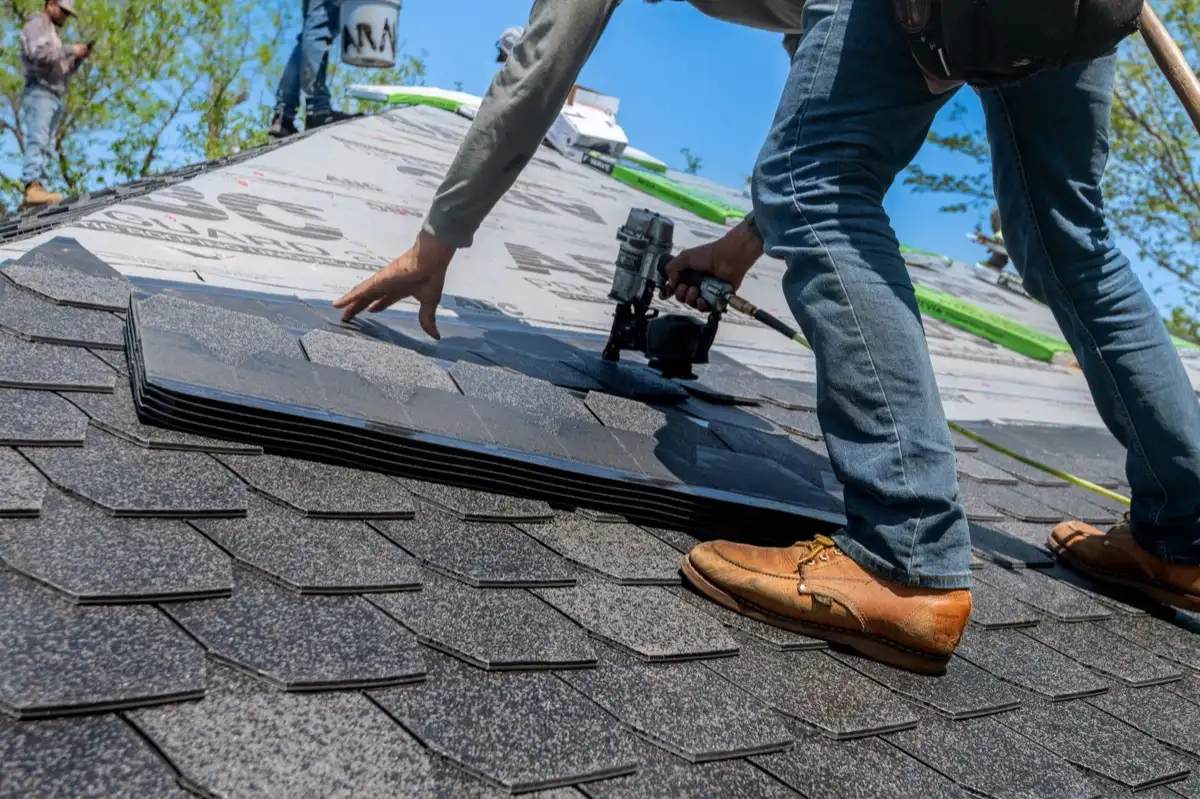 Inspecting an asphalt shingle slope after a hailstorm in Everett, WA